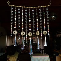 Adorn your personal space with our unique, exceptional chandelier beaded curtain or what we lovingly refer to as a "Window Necklace". The fluid nature (similar to a necklace) of this eleven strand hanging, allows for gentle movement after being hung which creates wonderful and beautiful reflections with just about any light and atmosphere.New Asfour chandelier crystal prisms (Epic Rainbows!). Beads and gemstones include: Aventurine, Green Quartz, Green Kyanite. Vintage and new Czech glass.