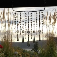 Adorn your personal space with our unique, exceptional chandelier beaded curtain or what we lovingly refer to as a "Window Necklace". The fluid nature (similar to a necklace) of this eleven strand hanging, allows for gentle movement after being hung which creates wonderful and beautiful reflections with just about any light and atmosphere.New Asfour chandelier crystal prisms (Epic Rainbows!). Beads and gemstones include: Aventurine, Green Quartz, Green Kyanite. Vintage and new Czech glass.