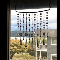 Adorn your personal space with our unique, exceptional chandelier beaded curtain or what we lovingly refer to as a "Window Necklace". The fluid nature (similar to a necklace) of this eleven strand hanging, allows for gentle movement after being hung which creates wonderful and beautiful reflections with just about any light and atmosphere.New Asfour chandelier crystal prisms (Epic Rainbows!). Beads and gemstones include: Aventurine, Green Quartz, Green Kyanite. Vintage and new Czech glass.