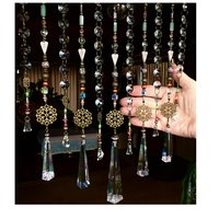 Adorn your personal space with our unique, exceptional chandelier beaded curtain or what we lovingly refer to as a "Window Necklace". The fluid nature (similar to a necklace) of this eleven strand hanging, allows for gentle movement after being hung which creates wonderful and beautiful reflections with just about any light and atmosphere.New Asfour chandelier crystal prisms (Epic Rainbows!). Beads and gemstones include: Aventurine, Green Quartz, Green Kyanite. Vintage and new Czech glass.