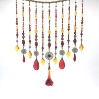 Adorn your personal space with our unique, exceptional chandelier beaded curtain or what we lovingly refer to as a "Window Necklace".  The fluid nature (similar to a necklace) of this eleven strand hanging, allows for gentle movement after being hung which creates wonderful and beautiful reflections with just about any light and atmosphere.

Vintage Murano chandelier focal, new and vintage chandelier prism, and stamped Strass Swarovski crystal. Beads: Ruby, Swarovski, and Czech glass beads.