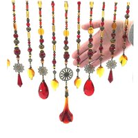 Adorn your personal space with our unique, exceptional chandelier beaded curtain or what we lovingly refer to as a "Window Necklace".  The fluid nature (similar to a necklace) of this eleven strand hanging, allows for gentle movement after being hung which creates wonderful and beautiful reflections with just about any light and atmosphere.

Vintage Murano chandelier focal, new and vintage chandelier prism, and stamped Strass Swarovski crystal. Beads: Ruby, Swarovski, and Czech glass beads.