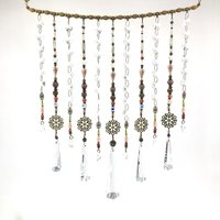 Adorn your personal space with our unique, exceptional chandelier beaded curtain or what we lovingly refer to as a "Window Necklace". The fluid nature (similar to a necklace) of this eleven strand hanging, allows for gentle movement after being hung which creates wonderful and beautiful reflections with just about any light and atmosphere.New Asfour chandelier crystal prisms (Epic Rainbows!). Beads and gemstones include: Aventurine, Green Quartz, Green Kyanite. Vintage and new Czech glass.
