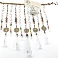 Adorn your personal space with our unique, exceptional chandelier beaded curtain or what we lovingly refer to as a "Window Necklace". The fluid nature (similar to a necklace) of this eleven strand hanging, allows for gentle movement after being hung which creates wonderful and beautiful reflections with just about any light and atmosphere.New Asfour chandelier crystal prisms (Epic Rainbows!). Beads and gemstones include: Aventurine, Green Quartz, Green Kyanite. Vintage and new Czech glass.