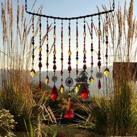 Adorn your personal space with our unique, exceptional chandelier beaded curtain or what we lovingly refer to as a "Window Necklace".  The fluid nature (similar to a necklace) of this eleven strand hanging, allows for gentle movement after being hung which creates wonderful and beautiful reflections with just about any light and atmosphere.

Vintage Murano chandelier focal, new and vintage chandelier prism, and stamped Strass Swarovski crystal. Beads: Ruby, Swarovski, and Czech glass beads.